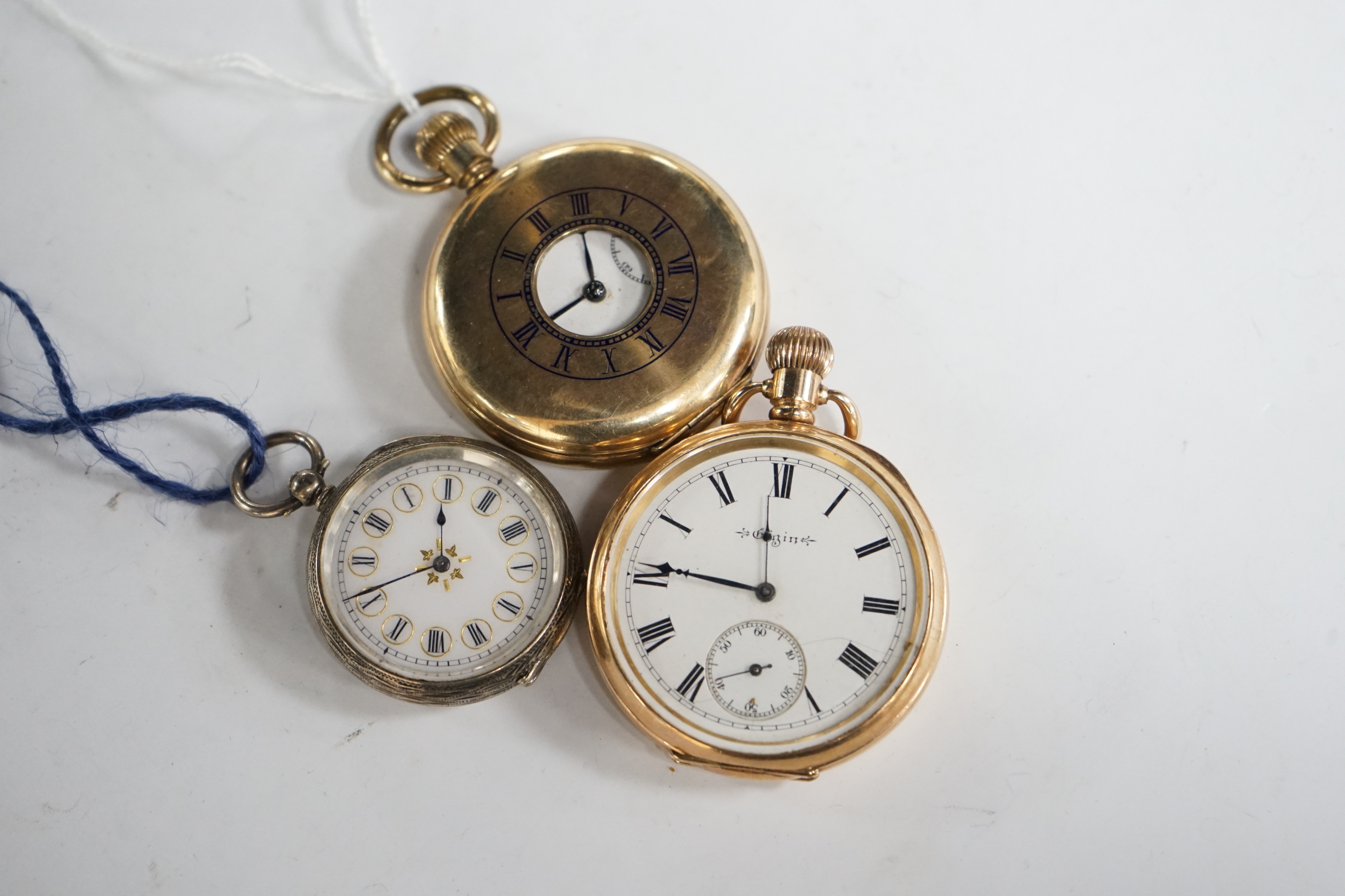 A continental engraved 935 white metal open face fob watch, together with an Elgin gold plated open face pocket watch and a gold plated half hunter pocket watch.